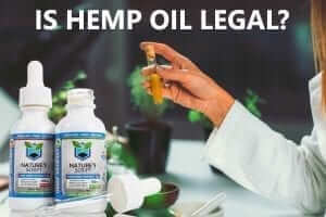woman holding test tube is cbd hemp oil legal preview